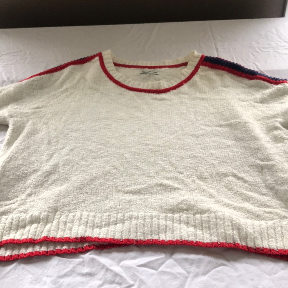 White sweater with blue and red detailing